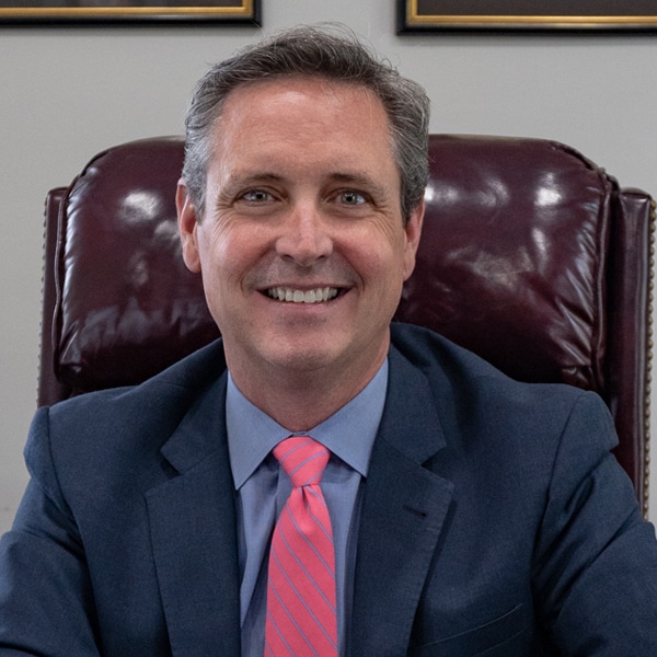 Headshot of John M. Simms